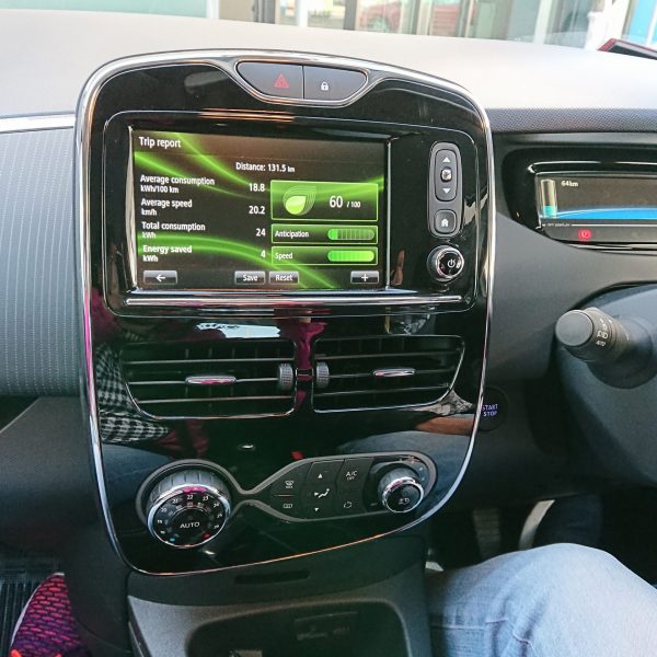 A modern car infotainment system displaying navigation, music, and connectivity features on a sleek touchscreen interface.